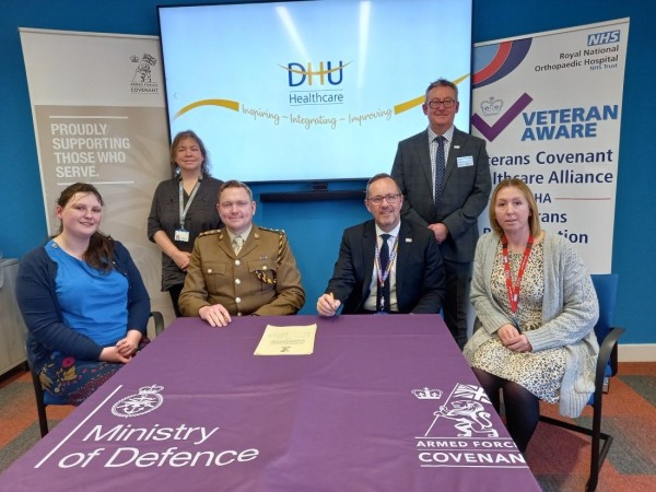 Pictured are members of DHU signing the Armed Forces Covenant